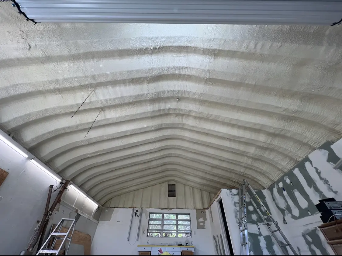 Spray polyurethane foam applied to the underside of a metal roof deck in Lakeville